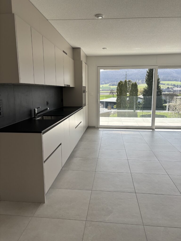 Séjour-cuisine carrelage Jura Suisse