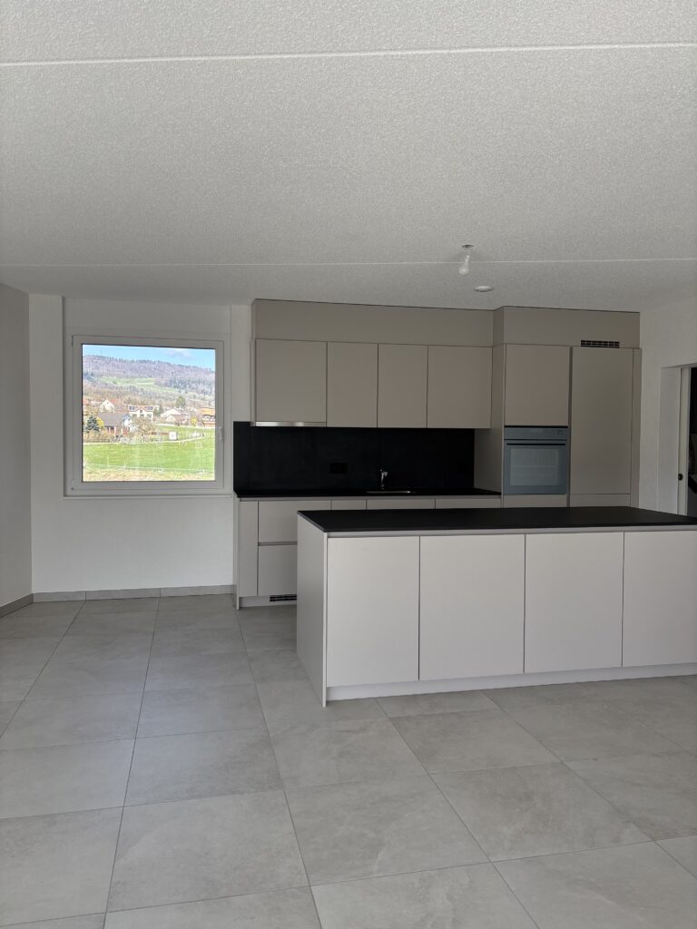 Séjour-cuisine carrelage Jura Suisse